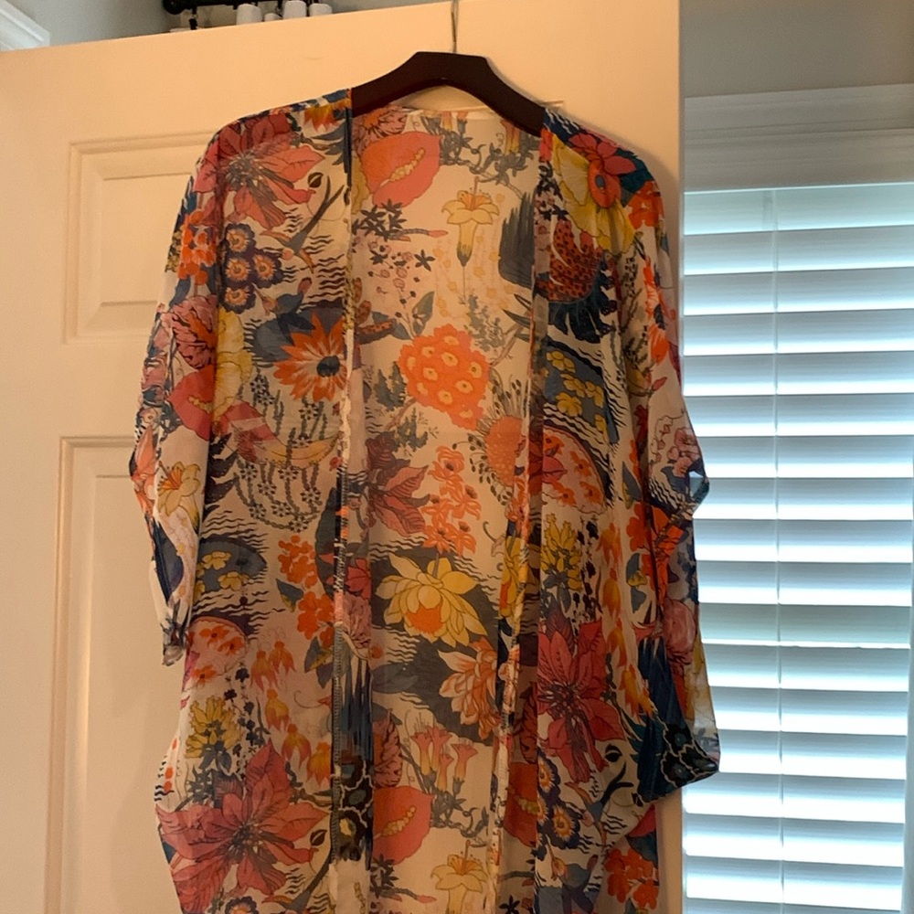 One size fits all silk-like throw with sleeves